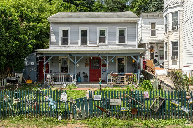 The owner of this colonial home Has a lot to say as evidenced by their curb appeal.