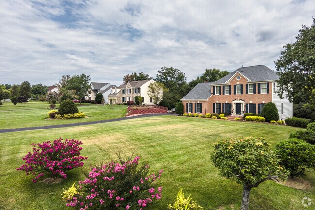 With expansive yards, and tree lined streets, the Colonial homes in Woodmore are a quiet place.