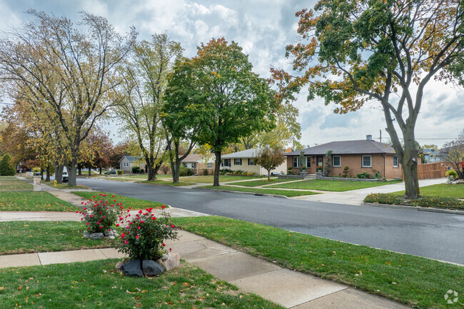 Shore Highlands has well manicured lawns and mature trees along it's sidewalks.