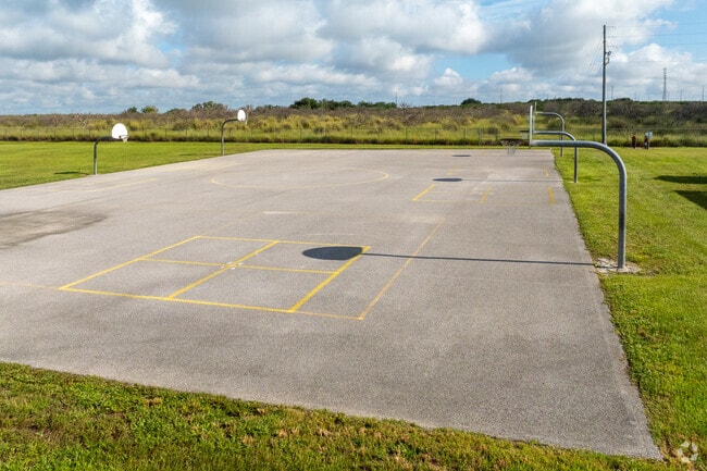 Memorial Elementary School has an outdoor basketball court for kids to play at recess.