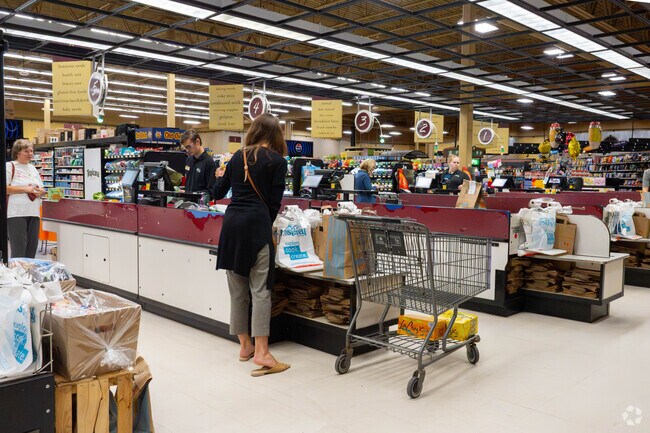 Shoppers check out at Festival Foods in nearby Hugo.