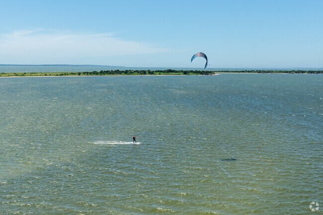 Try wind surfing at Waquoit Bay in New Seabury-Popponesset Island.