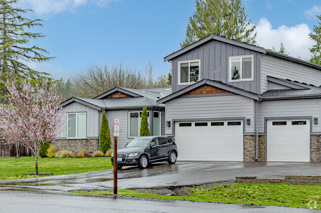 This stunning craftsman home has 2 garages and a lovely cherry tree in its front lawn in Spring Glen.
