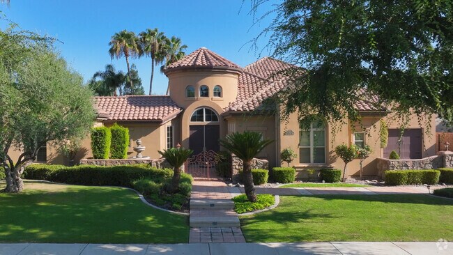 This Spanish style home in Masterpiece Estates has a grand entrance.