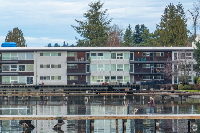 Live the condo life along the water in Central Houghton.