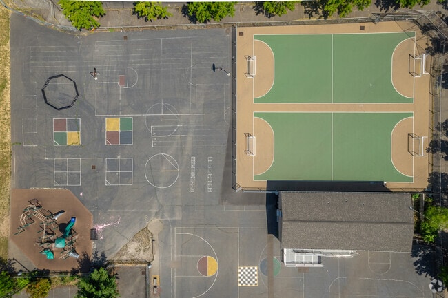 Looking down on the futsal courts and pave play area at the Cesar Chavez K-8 School.