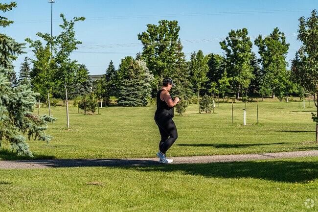 Stroll along the picturesque paths at Woodbury Park in the Bluemont Lakes neighborhood.