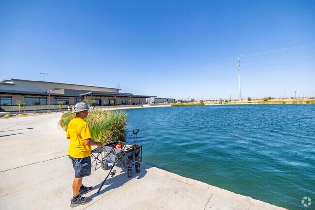 Fishing enthusiasts living near The Villages at Queen Creek enjoy peaceful mornings by nearby ponds and lakes.