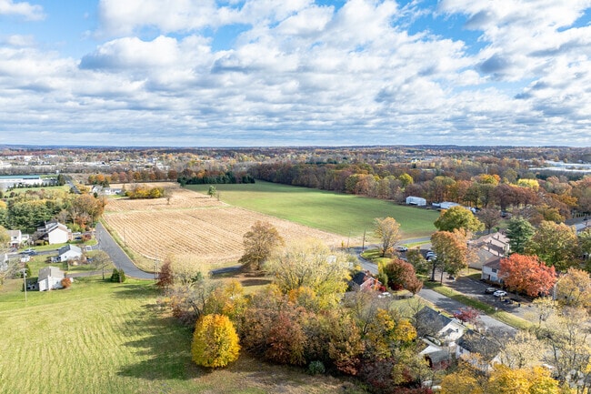 Farmland surrounds homes along quiet roads near Telford.