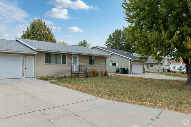Ranch homes with neat yards sit behind mature tree's in the established Riverside neighborhood.