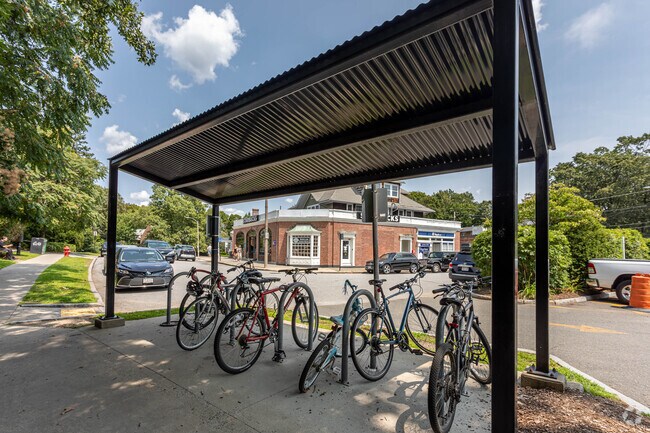 People in Waban travel on foot and on bikes around town.