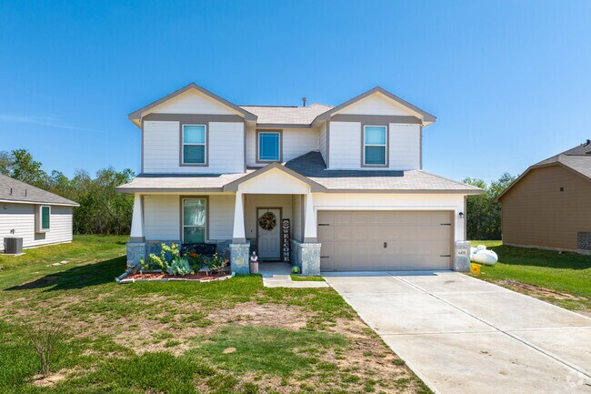 A two-story home sits on a fair-sized lot, just inside Hitchcock city limits.