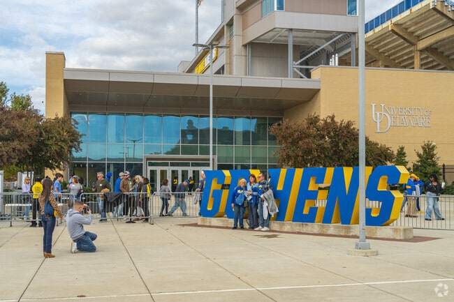 Newark residents come out to support the Blue Hens at University of Delaware football games.