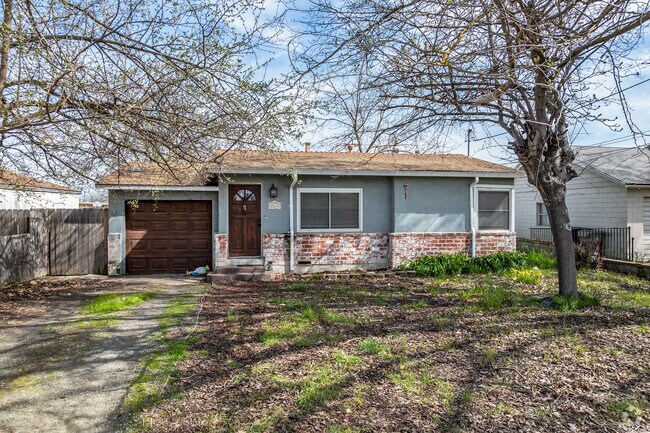 This older ranch-style home has a brick base with only a single car garage in Ben Ali.