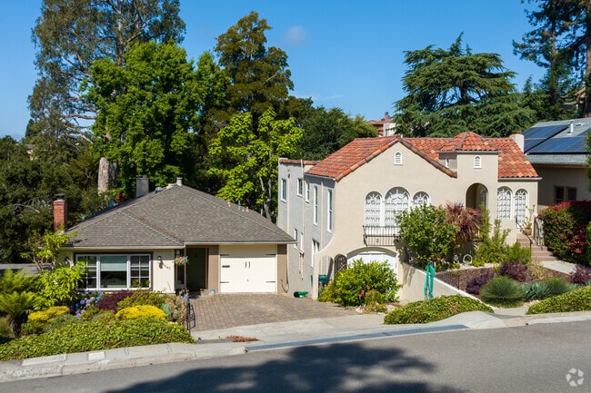 The well-manicured front lawns in Upper Rockridge contribute to the overall appeal of the area.