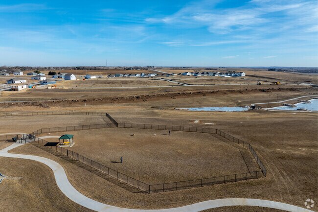 Enjoy the outdoors with your furry friend at the dog park in Gretna Crossing Park.