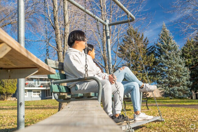 Swinging benches and open fields make Sunset Ridge Park a hit with Kohlman Lake locals.