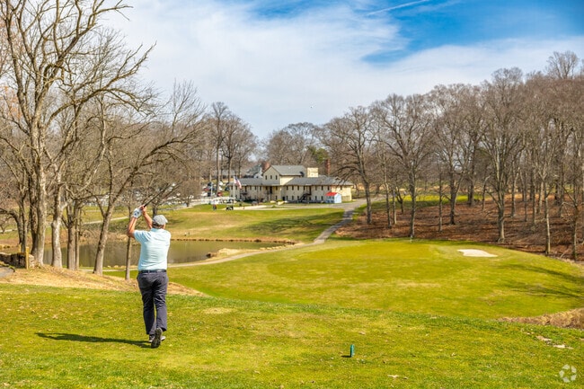 Practice on the driving range before you play 18 holes near Pike Creek at Delcastle Golf Club.