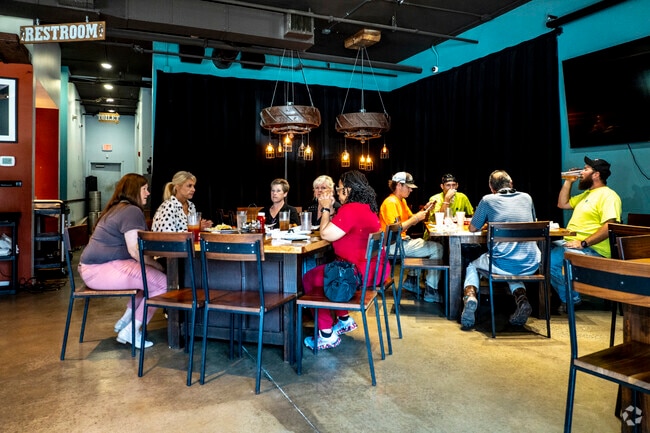 The Brick Pleasant Hill is a beloved eatery known for its welcoming, no-frills bar atmosphere.