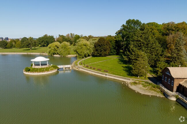 Park visitors enjoy the lakeside gazebo at Onondaga Park for peaceful moments with nature.