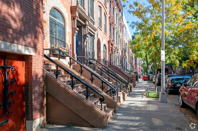 Astor Row is a beautiful scene of green trees and histoirc homes.