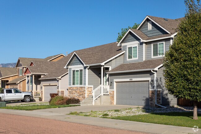 Large craftsman-style homes with multi-car garages are common in Fountain Valley Ranch.