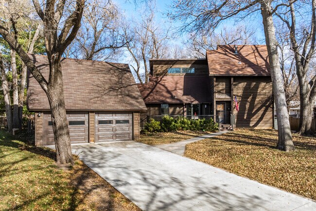 Large modern homes may have detached garages in the Central Topeka neighborhood.