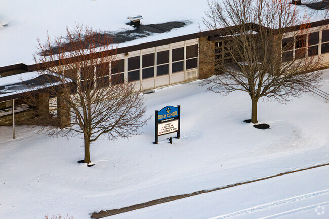 Charles E. Riley Elementary School in Oswego's sign at the main entrance.