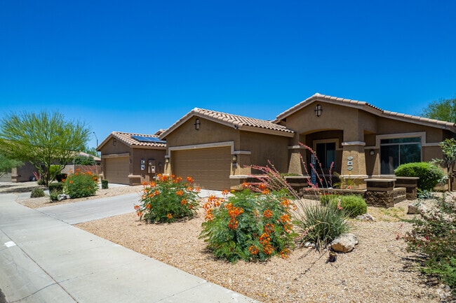 Estrella Mountain homes blend stucco, stone and solar for sustainable Arizona living.