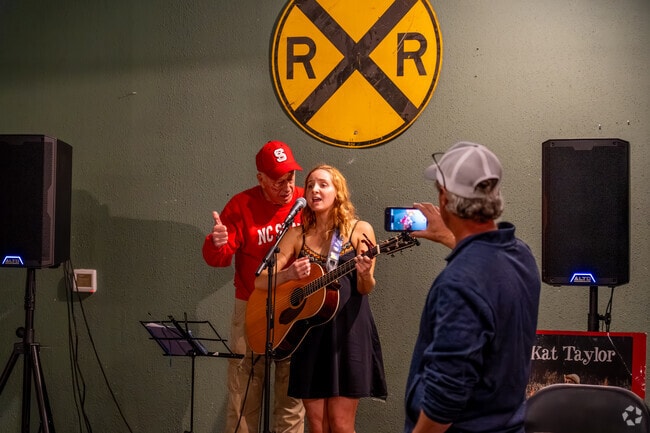 Kat Taylor shares the mic with her grandad at Wendell's Whistlestop Bottleshop.
