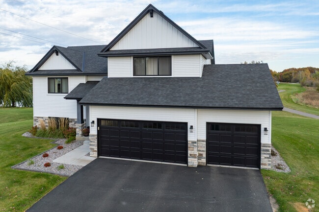 Neo-traditional homes in East Bethel feature upgraded interiors and landscaped yards.