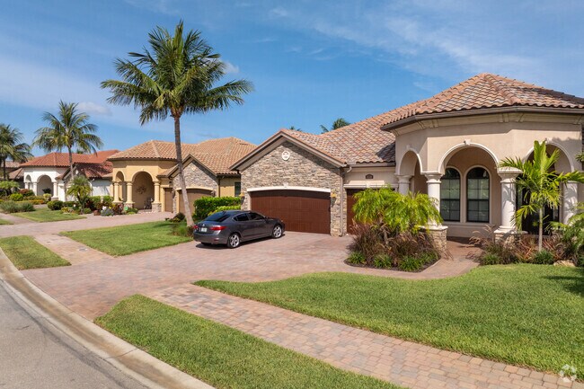 Mid-range houses with varied architectural styles line the quiet streets of Wentworth Estates.