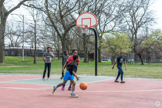 Kids love shooting hoops at the outdoor court at Trumbull Park.