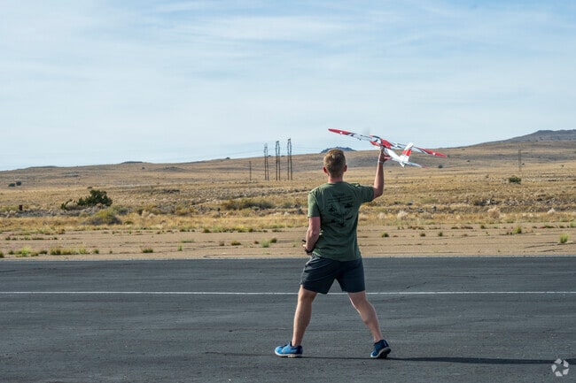 Remote-controlled planes soar at George J. Maloof Memorial Air Park’s open flying space.