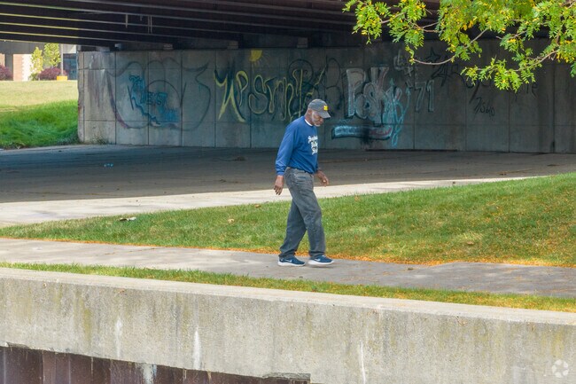 Locals enjoy the quiet solitude of Riverfront Saginaw in Cathedral District.