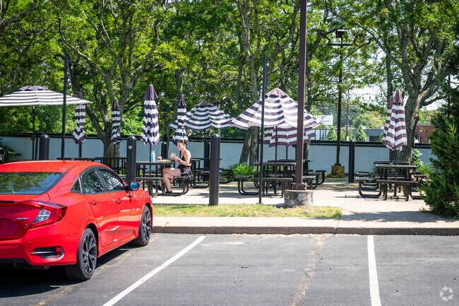 A young girl is eating at Plant City X, a vegan restaurant located in Cowesett, RI.