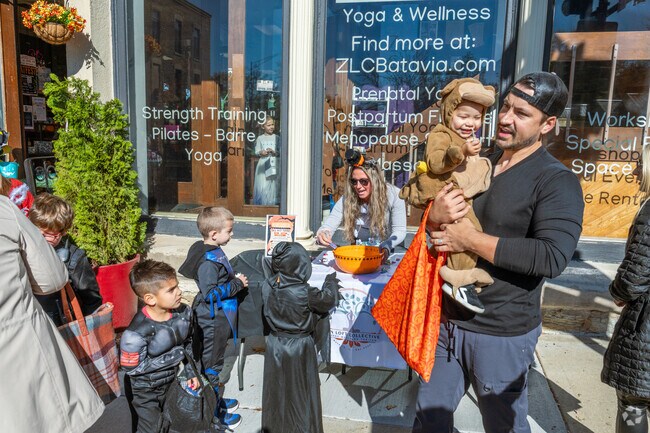 Families trick-or-treat at BatFest in Batavia.