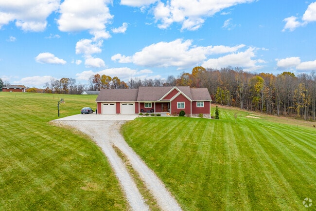 Long driveways, stretching across large plots of land, lead to colorful ranch-style homes in Franklin Township.