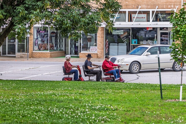 Residents enjoy the scenes found in downtown Nevada.