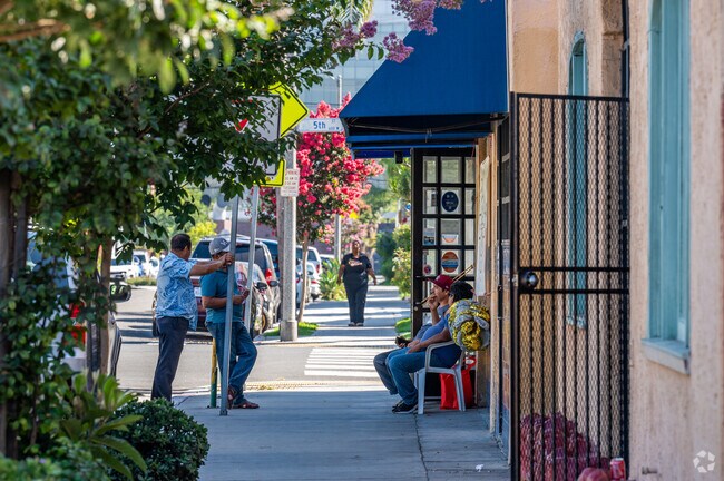 Residents enjoying a conversation in West Village-Long Beach.