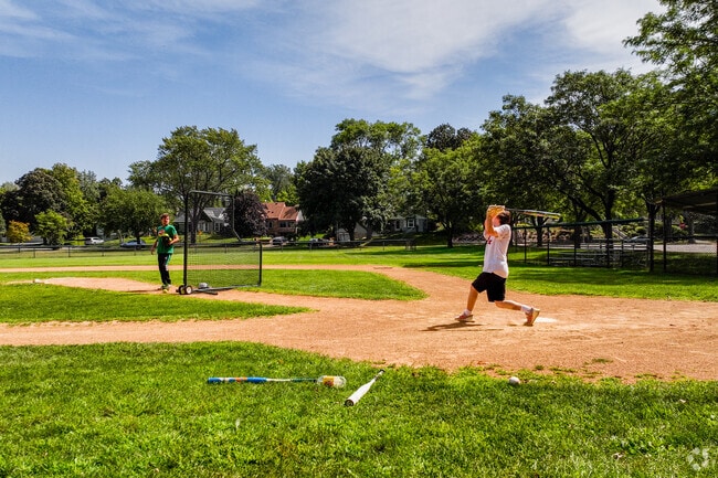 Kids at batting practice on one of Alpine Park's baseball fields.
