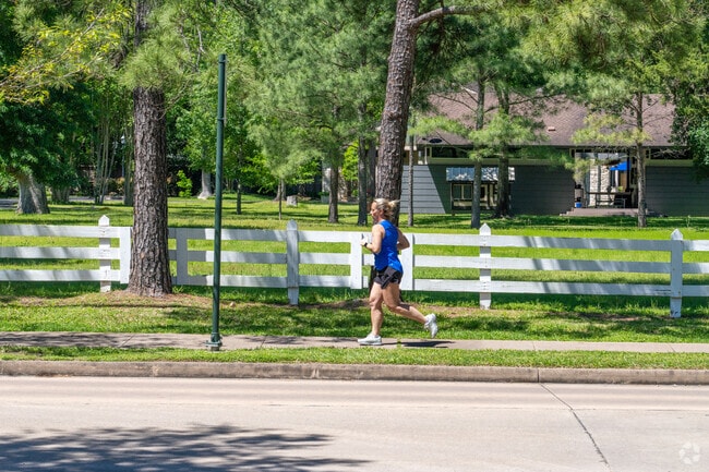 Residents of Piney Point Village jog through the neighborhood.