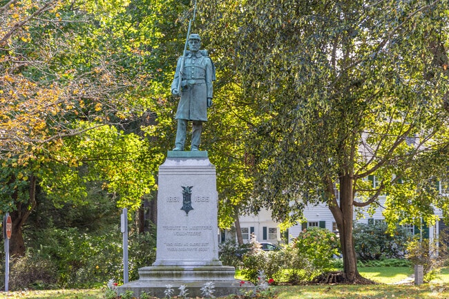 A historic statue stands in the town center of Westford, MA.
