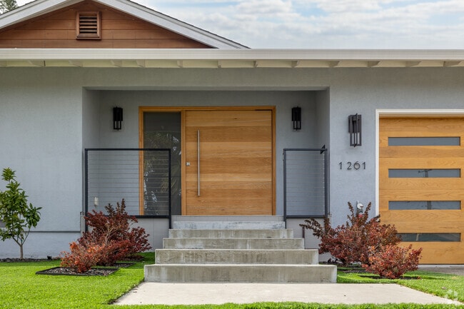 A custom wood front door is the highlight of this updated home in Millbrae Meadows.