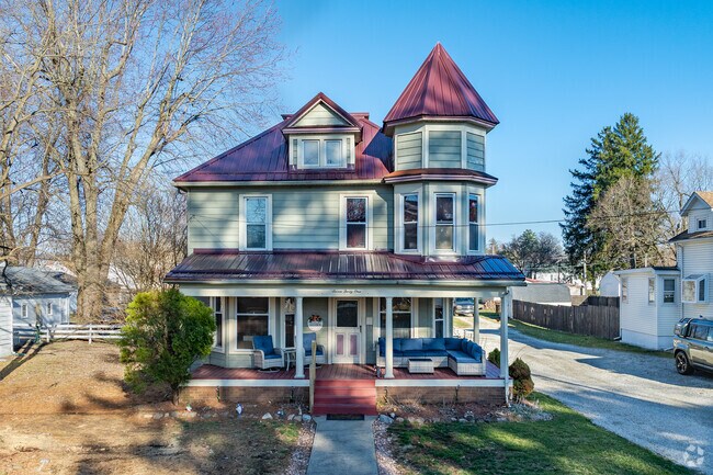 A historic Victorian home in Galion, Ohio  features a covered front porch.