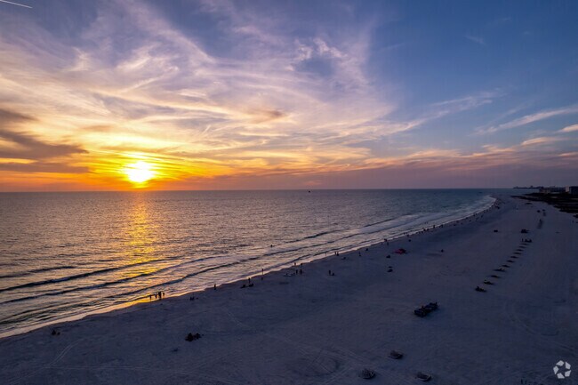 Sit on the white sand beaches & take in the sunsets on Treasure Island.