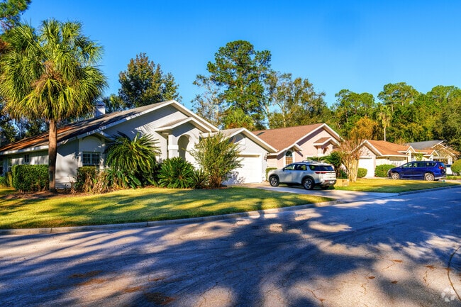 Mature trees offer privacy and shade to this row of homes in Rosemont.