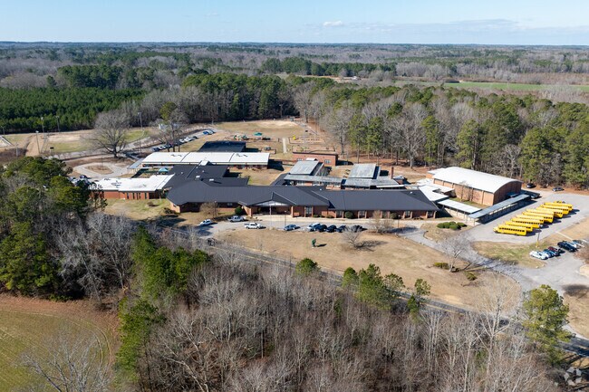 Surrounded by tree canopy, Bunn Elementary School provides a tranquile backdrop to its students.