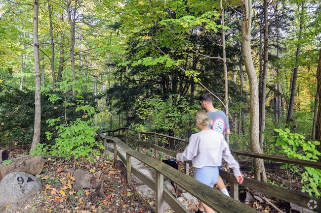 The Delaware Trails neighborhood offers hiking trails through wooded areas.