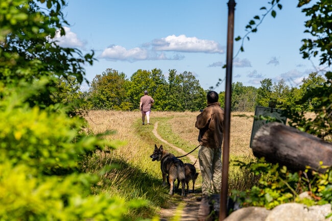 There are large, open spaces for residents to hike and walk their dogs.